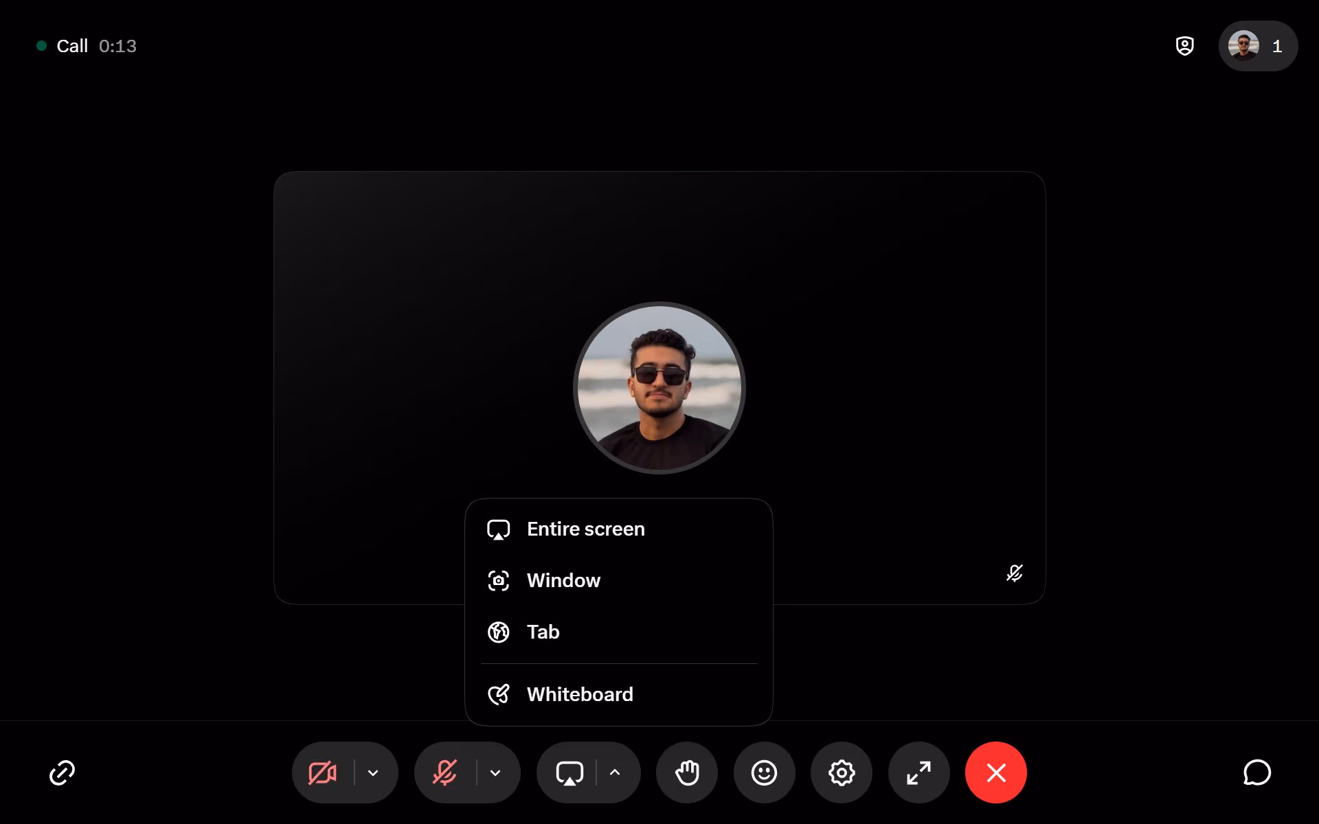 Call controls show screen sharing choices, a Whiteboard option, reactions and microphone and camera controls.