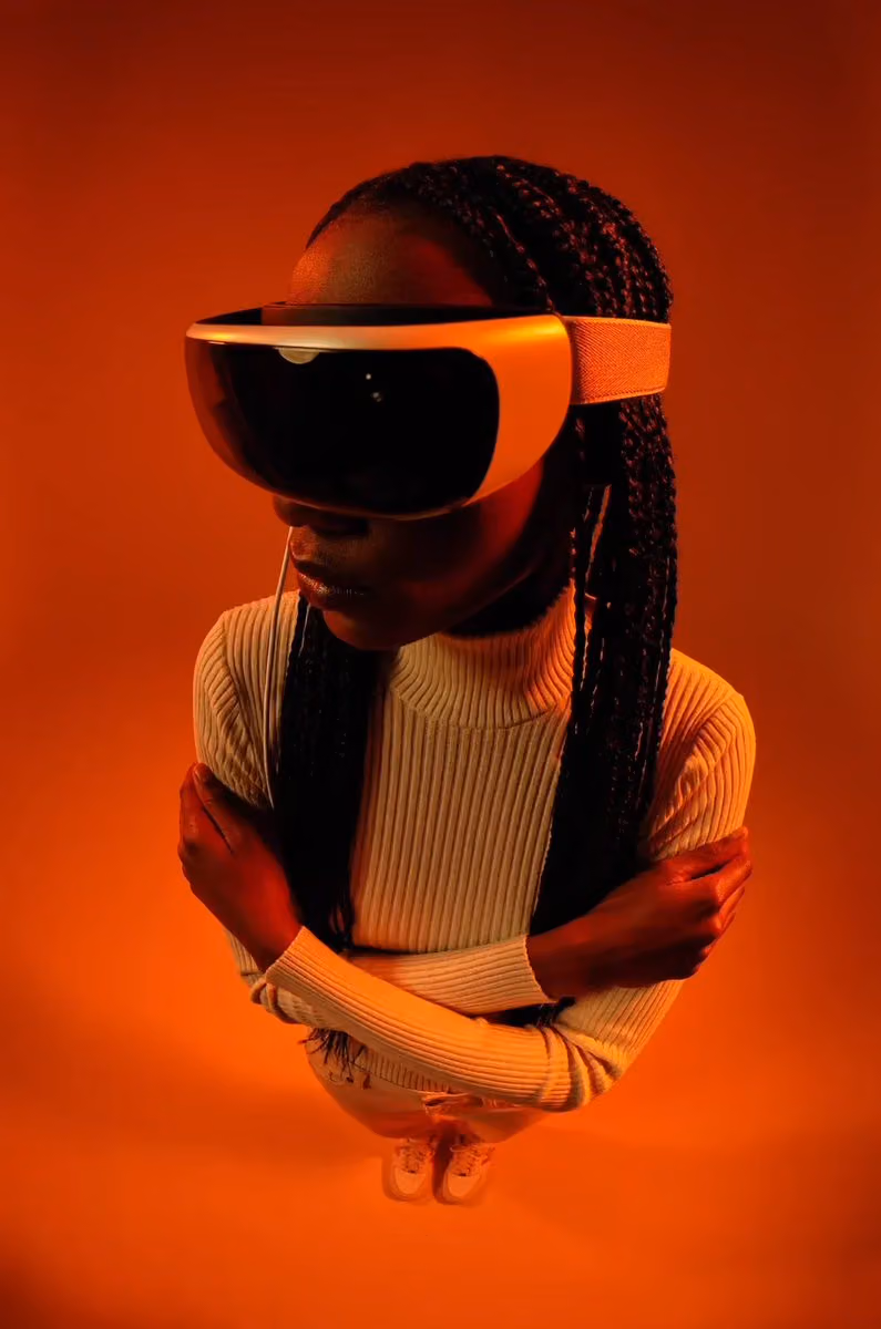 Portrait scene shows a person wearing a large black headset against vivid orange lighting