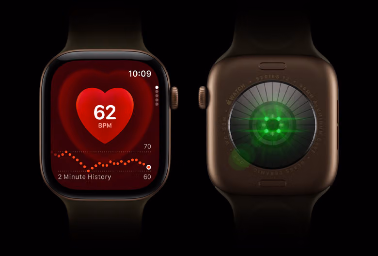 Two Apple Watch Series 12 devices side by side, showing the back crystal with bright green sensor lights and the front display with a heart rate monitor.