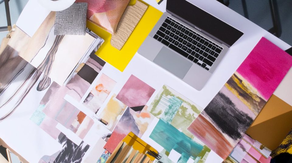A stylish interior designer's workspace featuring a mood board. ai generated